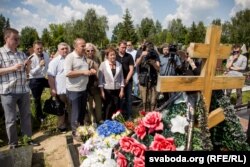 People gather at the gravesite of journalist Pavel Sheremet in Minsk on July 20.