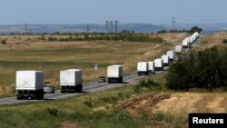 Russia -- A Russian convoy of trucks carrying humanitarian aid for Ukraine drives along a road in the direction of the border with Ukraine, after leaving Kamensk-Shakhtinsky, Rostov Region, August 17, 2014