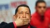 Venezuelan President Hugo Chavez blows a kiss as he arrives at a rally with supporters in Caracas in February 2012, before flying to Cuba for a new round of cancer surgery.