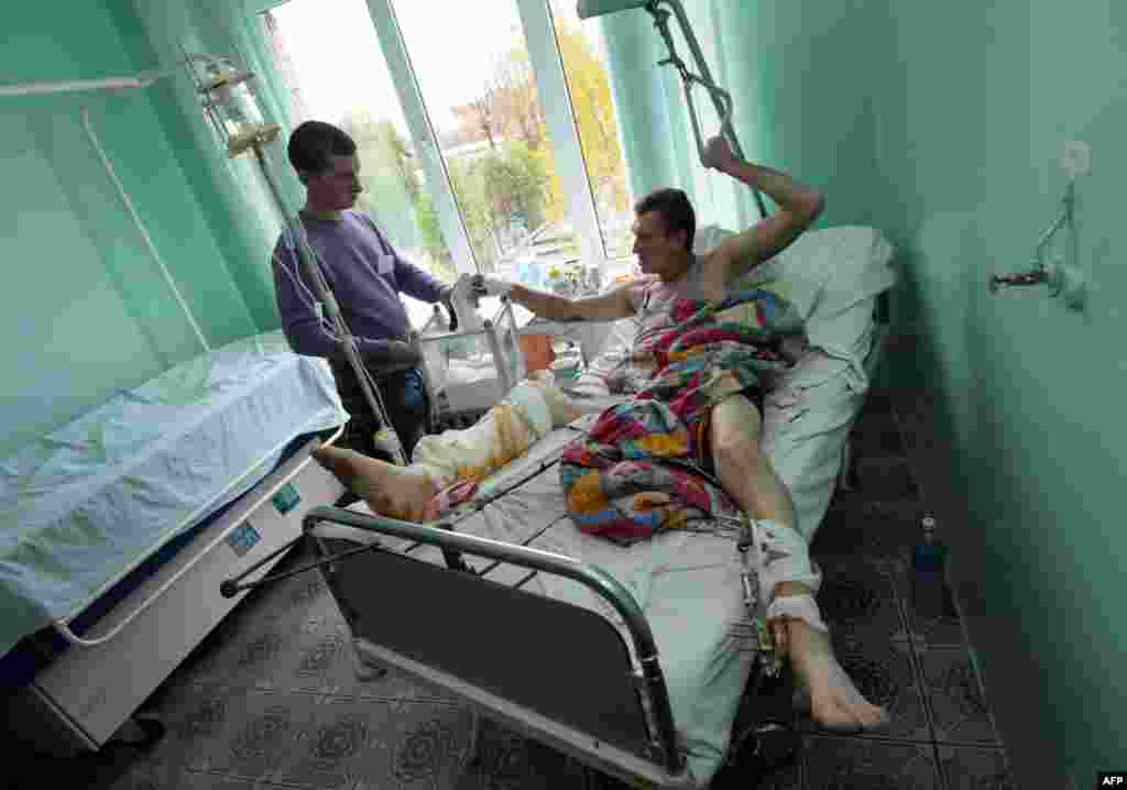 A patient votes at a hospital in Lviv.