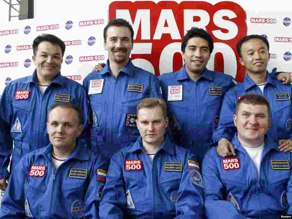 The seven volunteers for the Mars-500 experiment, only six of which actually entered the simulator: Aleksei Sitev, Aleksandr Smoleyevsky, and backup Mikhail Sinelnikov (left to right, front row) and Sukhrob Kamolov, Romain Charles, Diego Urbina, and Wang Yue (left to right back row)