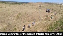 Residents of Arys in Kazakhstan being evacuated on June 24.