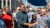 Russian opposition leader Aleksei Navalny (center) shakes hands with people during an opposition rally in Moscow last month against proposed pension reforms. 