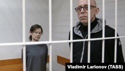 Yelena Reshetova (left) and Vadim Vinogradov attend the court hearing on March 18.