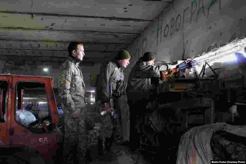 Ukrainian troops watch shells land on Avdiyivka from a machine-gun emplacement in Pisky, on the battle&#39;s southern flank. April 3, 2016