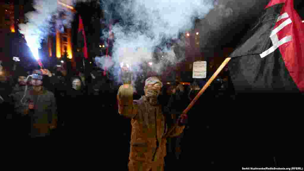 Protesters approach the offices of a company belonging to oligarch Rinat Akhmetov in Kyiv.