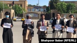 Afghan activists protest to demand justice for their compatriots who were allegedly tortured and thrown into a river by the Iranian border guards.