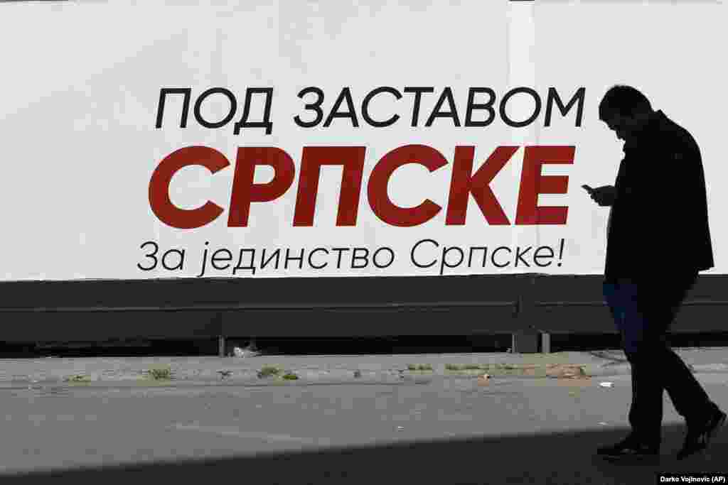 A man walks by an election poster reading: &quot;Under the flag of Srpska -- For the unity of Srpska!&quot; in the Bosnian town of Banja Luka, 240 kilometers northwest of the capital Sarajevo. (AP/Darko Vojinovic)