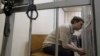 Михаил Косенко во время заседания суда по избранию меры пресечения в рамках «Болотного дела», май 2013 года. Впоследствии Михаил был приговорен к принудительному психиатрическому лечению. Архивное фото