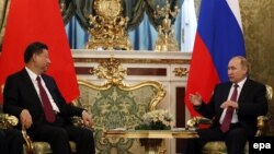 Председатель Китая Си Цзиньпин и президент России Владимир Путин на встрече в Кремле 4 июля 2017 года.