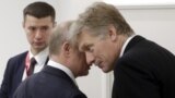JAPAN – Russia's President Vladimir Putin (L) talks to his spokesman Dmitry Peskov before during a meeting with Turkey's President Recep Tayyip Erdogan (not in picture) on the sidelines of a G20 leaders summit. Osaka, June 28, 2019