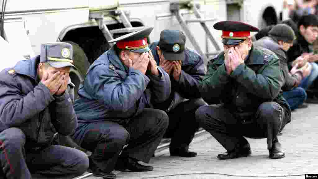 Kyrgyz police officers take part in prayers on the first day of the Muslim holiday of Kurban Bairam (Eid al-Adha) in Bishkek on October 26. (Reuters/Vladimir Pirogov)