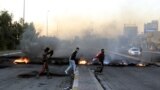 IRAQ PROTESTS -- Demonstrators burn tires to close a way in central Karbala city, southern Iraq, 24 December 2019. Al Binaa coalition (Construction coalition), one of Iraq's biggest coalitions, announced it had officially proposed Qusay al-Suhail for the 