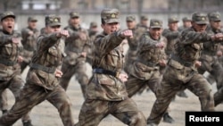 Recruits in People's Liberation Army training at a military base in Yinchuan, Ningxia Hui Autonomous Region