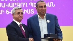 Armenia - President Serzh Sarkisian (L) awards a state medal to businessman Samvel Aleksanian in Yerevan, 26 September 2015.