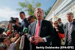 U.S. national-security adviser John Bolton speaks to the media after a wreath-laying ceremony at a memorial for soldiers killed in the conflict in eastern Ukraine, in Kyiv on August 27.