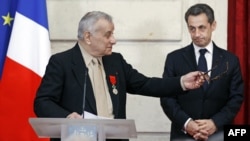 France -- Former WW II resistant Arsene Tchakarian delivers his speech after being awarded with the medal of Officer of the Legion of Honor by President Nicolas Sarkozy, (R) at the Elysee Palace in Paris, 07Mar2012