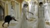 Chechnya -- A young woman tries on a wedding dress in an upmarket wedding salon in Grozny, 10Mar2011