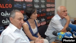 Armenia -- PM Vardan Bostanjian (L) and opposition representative Felix Khachatrian hold a public debate. 13July, 2011