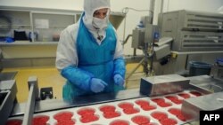 A worker at Spanghero, which is suspected of buying horse meat from Romania and then selling it to another French company, which made frozen meals. 