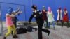 Russia -- A Cossack militiaman attacks Nadezhda Tolokonnikova and a photographer as she and fellow members of the punk group Pussy Riot, including Maria Alekhina, center, in the pink balaclava, stage a protest performance in Sochi, Russia, on Wednesday, F