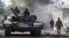 Танк российских гибридных войск на улице Донецка осенью 2014 года