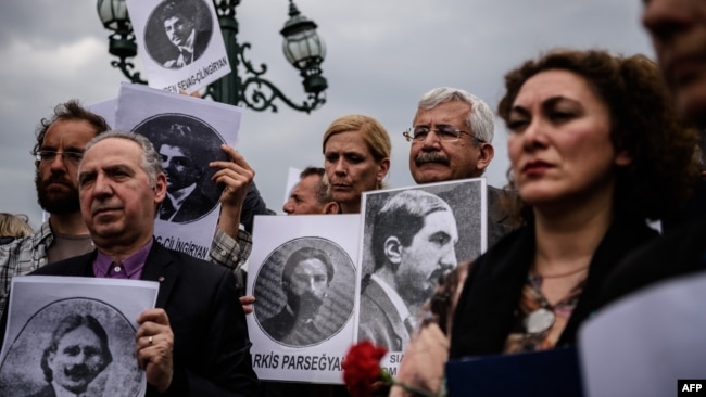 Turkey -- Human rights activists hold placards picturing Armenian intellectuals, detained and deported in 1915, during a rally in Istanbul, April 24, 2016