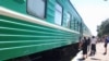 Kazakhstan – Passengers stand next to board a train at Ayaguz / Ayagoz railway station. East Kazakhstan region, 03Aug2014