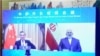 وانگ ای (چپ) وزیر خارجه چین در تماس ویدئویی با محمدجواد ظریف، همتای ایرانی‌اش