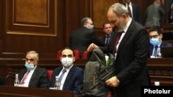 Prime Minister Nikol Pashinian and members of his government attend a parliament session in Yerevan on May 6.