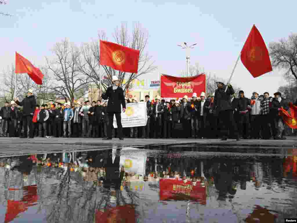 Kyrgyz youths wave national flags in a procession to commemorate State Flag Day in central Bishkek on March 3. Photo by Vladimir Pirogov for Reuters