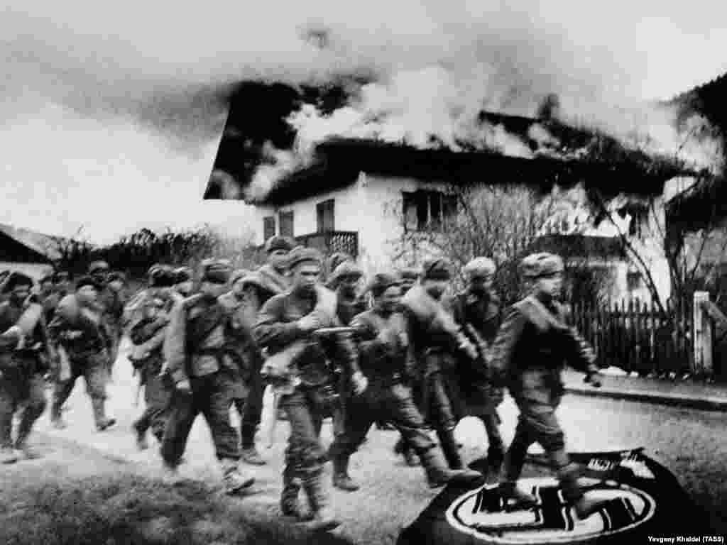 Soldiers of the Red Army march toward Berlin. Khaldei used a Leica camera&nbsp;fitted with a 35-millimeter lens while working on the front lines of World War II.