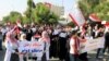 Students of Karbala University carry a banner reading in Arabic 'No nation, No permanence' as they take part in a protest and strike in Karbala, November 3, 2019