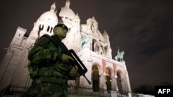 A French soldier stands guard outside the Sacre Coeur Basilica on November 16 in Paris.