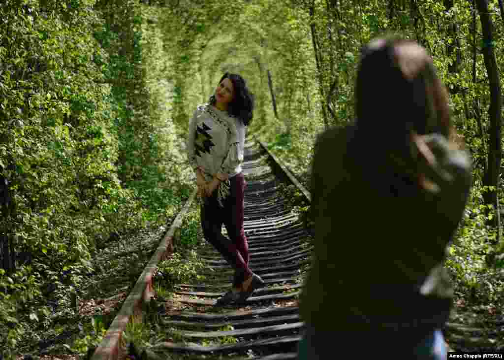 For 23 year old Halyna Savchyn, who traveled with her friend from their home town of Chernivtsi for this photoshoot, the tunnel is a source of pride for a country battered by current events. “It’s something beautiful, and it’s ours.”