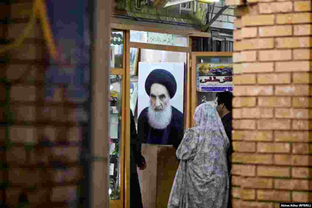  A portrait of Grand Ayatollah Ali al-Sistani, Iraq's highest Shi'ite authority, seen in one of the shops in Karbala.