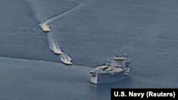 Iranian vessels take part in what what the U.S. Navy says were "unsafe and unprofessional actions against U.S. navy ships in the Persian Gulf on April 15. 