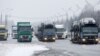 Trucks wait on the Belarusian-Russian border, December 8, 2014
