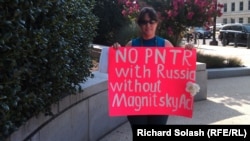 Russian-American Tanja Nyberg demonstrates outside of the Senate Finance Committee meeting on July 18.