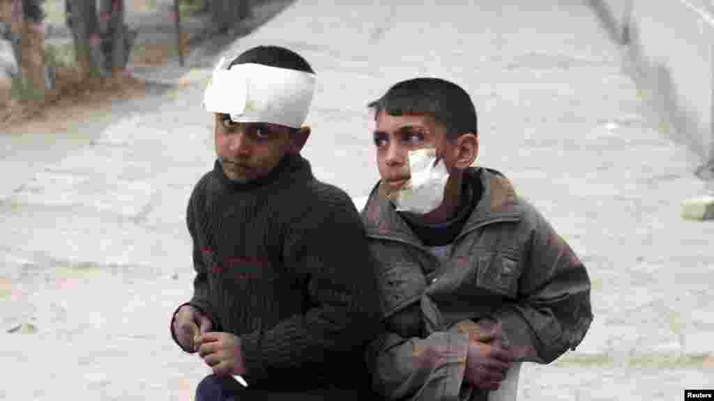 Boys wounded in a car-bomb attack are seen after treatment at a primary school in Mussayab, Iraq, on February 23. (REUTERS/Mushtaq Muhammed)