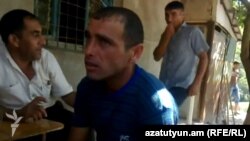 Azerbaijan - A screenshot of an amateur video of Armenian citizen Karen Petrosian talking to residents of Aqbulaq village.