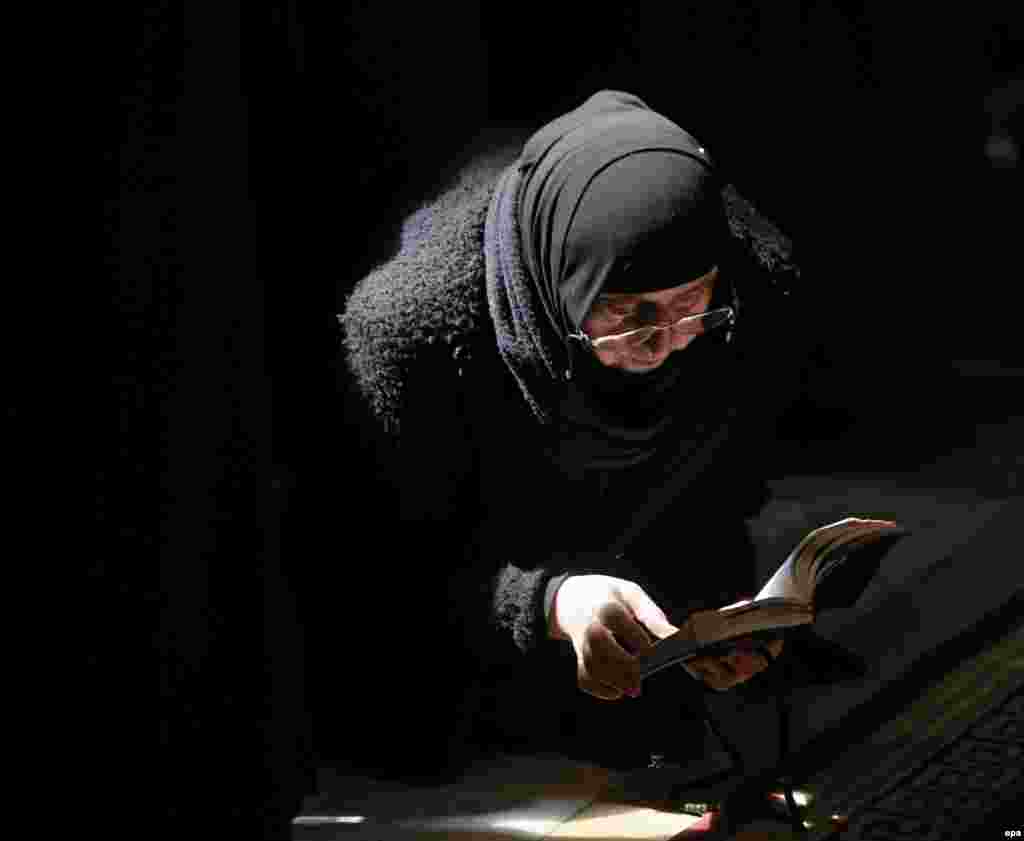 A Georgian Orthodox nun attends a religious service marking the Annunciation at the Svetitskhoveli Cathedral in Mtskheta, near Tbilisi, Georgia. (epa/Zurab Kurtsikidze)