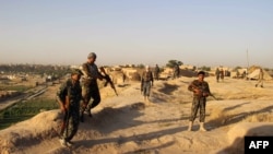 Afghan soldiers in Chardara district of Kunduz province on June 22.