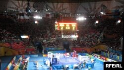 Bright lights, big money: a scene from the boxing competition at the Beijing Olympic Games in 2008.