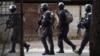 Georgian counterterrorist units move around an apartment block in Tbilisi on November 22.