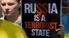 Молода українка з плакатом «Росія – держава-терорист» на акції протесту проти російської агресії щодо України. Мадрид, Іспанія, 29 червня 2022 року (ілюстраційне фото)