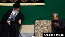 Iranian Supreme Leader Ayatollah Ali Khamenei (L) greets the commander of Iran's Qods Force, Major General Qassem Soleimani, during a religious ceremony in Tehran, March 27, 2015