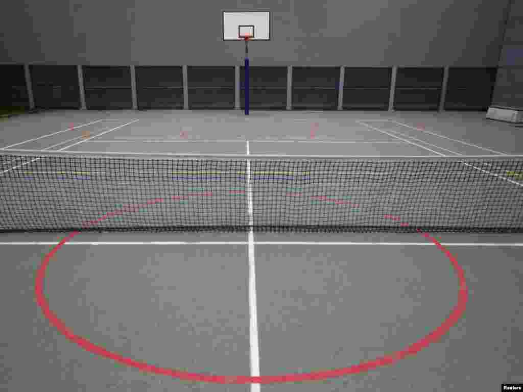 Tennis and basketball courts in the yard of the Detention Unit