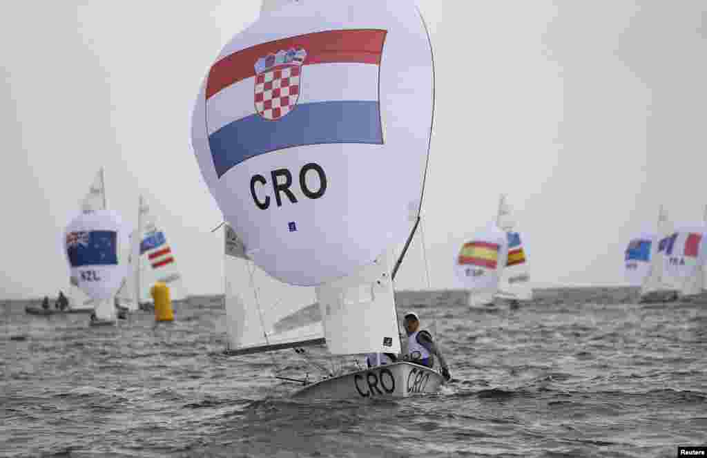 Sime Fantela and Igor Marenic of Croatia take the lead on their way to winning their first heat in the men's two-person dinghy competition. 