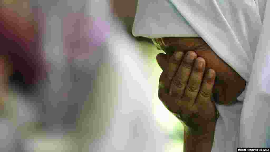 A woman grieves in Potocari after the caskets&#39; arrival there.